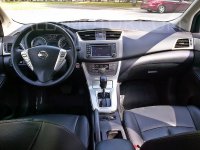 2014_Nissan_Tiida_Front_Dashboard_and_Steering.jpg
